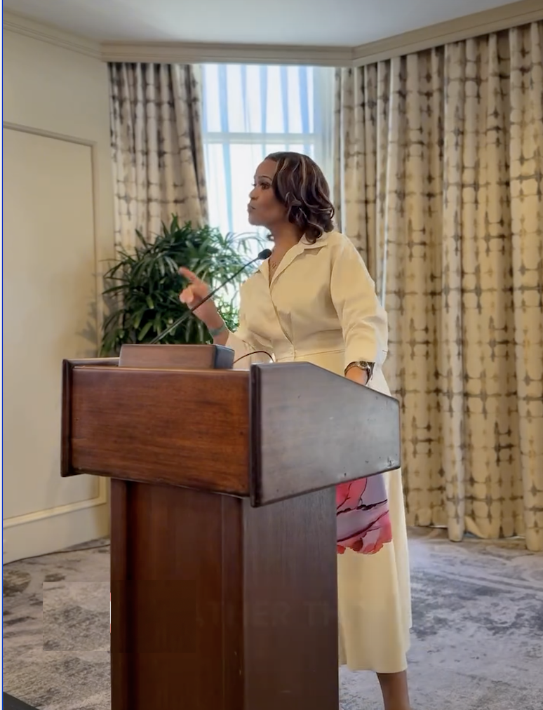 Sandra Diggs-Miller speaking at a podium